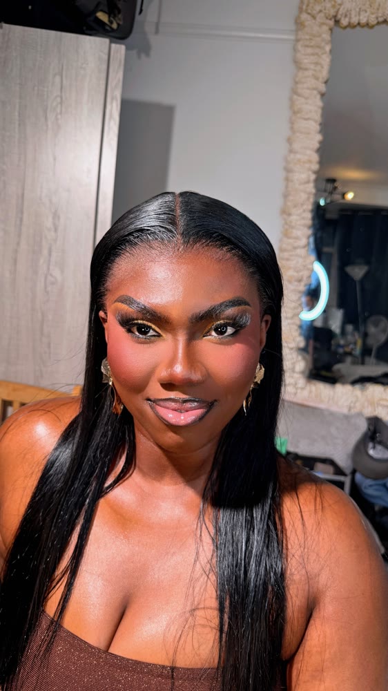 Full glam makeup with a sculpted base, smoky eye and bold lashes