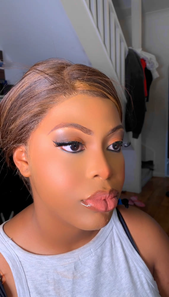 Prom makeup with shimmering eyeshadow and a glossy nude lip